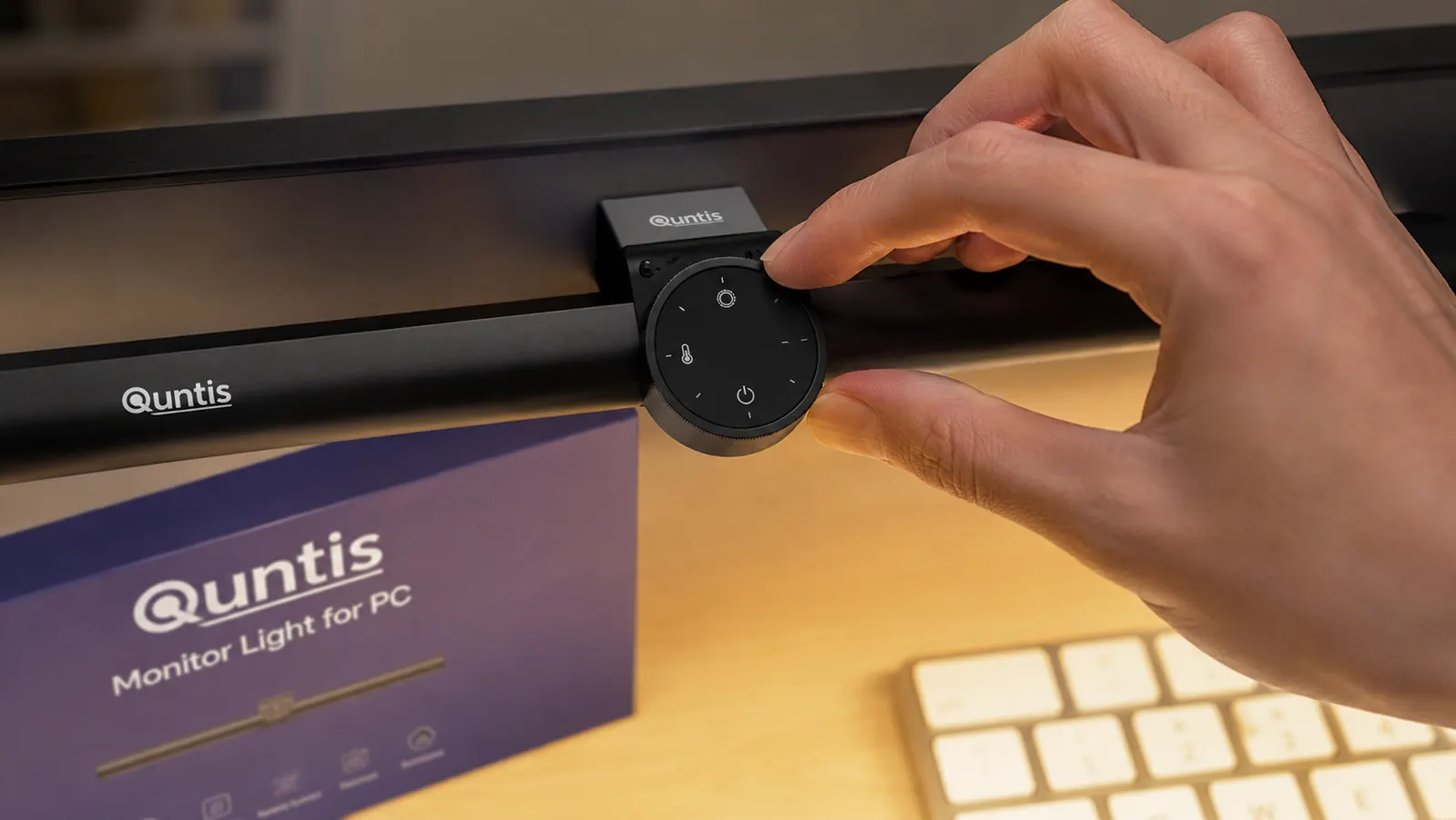 Touch control wheel on a monitor light bar being adjusted with one finger to change brightness