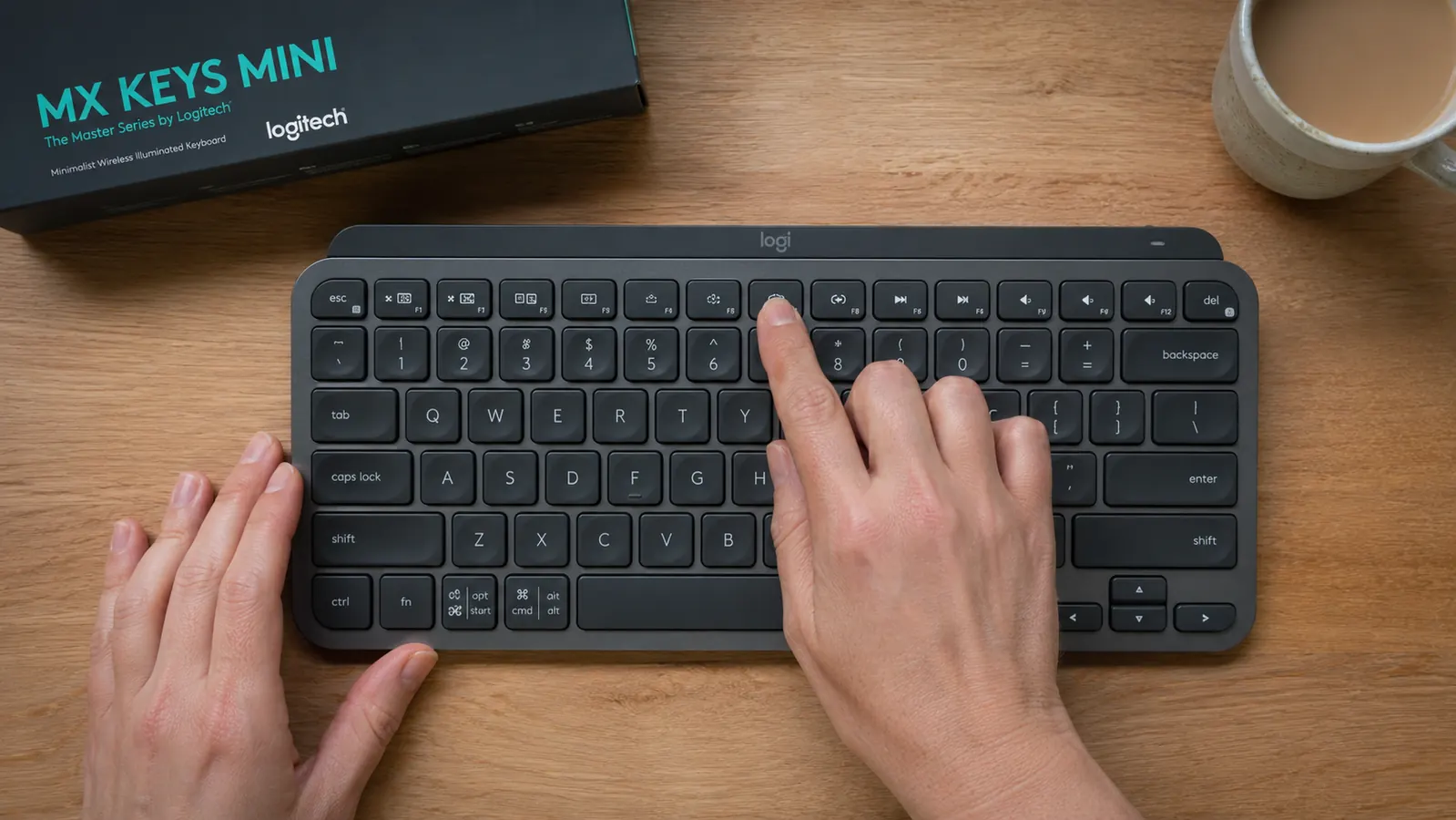 Top-down view of the Logitech MX Keys Mini function row showing dual-purpose keys with media symbols above F-key labels